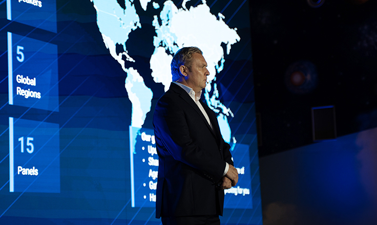 CEO of Comarch delivering a keynote speech on stage at the Comarch User Group 2026 conference.