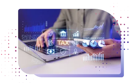 Financial compliance workspace showing hands typing on&nbsp;laptop and holding phone with TAX overlay icons and graphs.