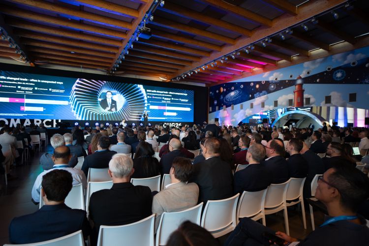 Audience and attendees watching a&nbsp;multimedia presentation during the Comarch User Group 2026&nbsp;conference.