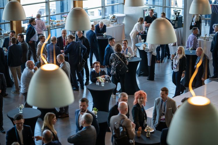 Business professionals and tech experts networking during a&nbsp;break at&nbsp;Comarch User Group 2026.